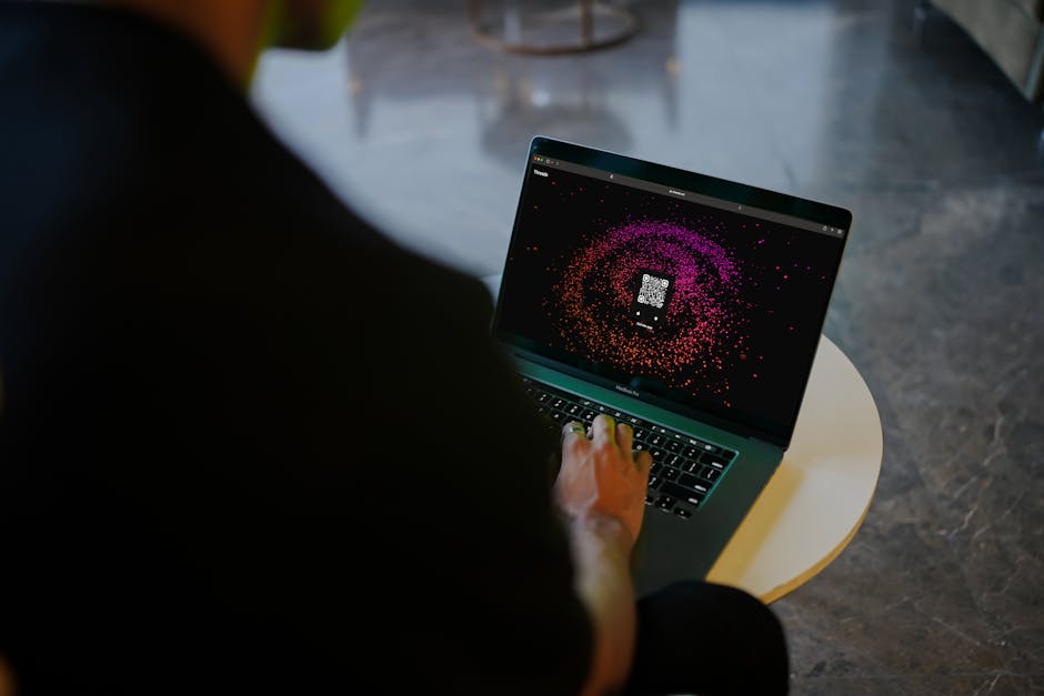 Person using laptop to run a Wi‑Fi speed test at home