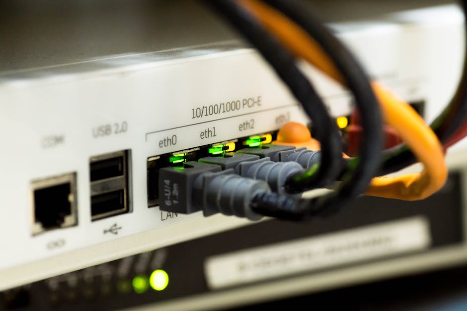 Laptop displaying router firewall and port forwarding settings while disabling unnecessary services