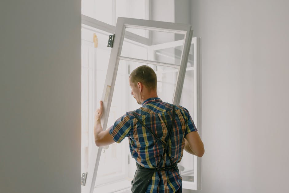 Technician reviewing ventilation settings during window replacement before installation